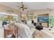 Light-filled living room featuring vaulted ceilings, stylish furnishings, and sliding glass doors leading to the lanai at 15375 Taurus Cir, Port Charlotte, FL 33981