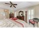 Comfortable main bedroom with a king-size bed, tray ceiling, and ample closet space at 15375 Taurus Cir, Port Charlotte, FL 33981