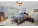 Spacious main bedroom with large bed, dresser, and window seating at 15375 Taurus Cir, Port Charlotte, FL 33981
