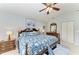 Main bedroom features a ceiling fan, closet, carpet flooring, and matching night stands at 15375 Taurus Cir, Port Charlotte, FL 33981