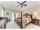 Spacious main bedroom featuring a king-size bed and access to the outdoors at 15375 Taurus Cir, Port Charlotte, FL 33981