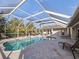 Relaxing pool and patio area with covered lanai and seating at 15375 Taurus Cir, Port Charlotte, FL 33981