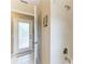 Shower featuring a handheld sprayer and glass door leading outside at 15375 Taurus Cir, Port Charlotte, FL 33981