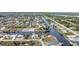 Wide aerial showcasing a waterfront community with many houses and canals at 15500 Longview Rd, Port Charlotte, FL 33981