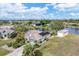 An aerial view of a canal-side home with a large backyard at 15500 Longview Rd, Port Charlotte, FL 33981