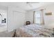 Bedroom with queen bed, ceiling fan, and closet at 15500 Longview Rd, Port Charlotte, FL 33981