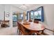 Bright dining room with wooden table and access to backyard patio at 15500 Longview Rd, Port Charlotte, FL 33981