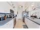Modern kitchen with stainless steel appliances and ample cabinet space at 15500 Longview Rd, Port Charlotte, FL 33981
