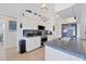 Well-equipped kitchen featuring stainless steel appliances and blue countertops at 15500 Longview Rd, Port Charlotte, FL 33981