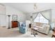 Light and airy living room featuring a comfy sofa and large window at 15500 Longview Rd, Port Charlotte, FL 33981