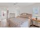 Spacious bedroom with king-size bed and ensuite bathroom access at 15500 Longview Rd, Port Charlotte, FL 33981