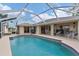 Relaxing pool and patio with access to indoor living space at 15500 Longview Rd, Port Charlotte, FL 33981