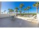 Private balcony with seating area and palm tree view at 1651 Beach Rd # 212, Englewood, FL 34223