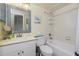 Bathroom with tub, toilet and vanity at 1651 Beach Rd # 212, Englewood, FL 34223