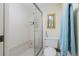 Shower and toilet in a small bathroom at 1651 Beach Rd # 212, Englewood, FL 34223