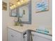 Clean bathroom with a vanity and mirror at 1651 Beach Rd # 212, Englewood, FL 34223