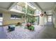 Peaceful courtyard with plants and seating at 1651 Beach Rd # 212, Englewood, FL 34223
