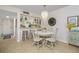 Bright dining area with table and chairs, adjacent to kitchen at 1651 Beach Rd # 212, Englewood, FL 34223