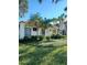 Single-story building with lush landscaping and mailbox at 1651 Beach Rd # 212, Englewood, FL 34223