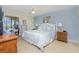 Main bedroom with king-size bed and ensuite bathroom at 1651 Beach Rd # 212, Englewood, FL 34223