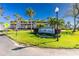 Sandpiper Rey community entrance sign with lush landscaping at 1651 Beach Rd # 212, Englewood, FL 34223
