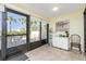 Sunroom with outdoor access and tiled flooring at 1651 Beach Rd # 212, Englewood, FL 34223