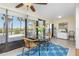 Sunroom features glass doors leading to balcony at 1651 Beach Rd # 212, Englewood, FL 34223