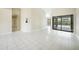 Spacious living area with tile floors and views of the pool at 17412 Wintergarden Ave, Port Charlotte, FL 33948