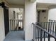Exterior view of condo building showing walkway, balcony, and building facade at 1751 Beach Rd # 204, Englewood, FL 34223
