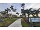 Landscaped walkway leading to Sandpiper Key condo building at 1751 Beach Rd # 204, Englewood, FL 34223