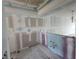 Under construction kitchen with tiled floor and drywall at 1751 Beach Rd # 204, Englewood, FL 34223