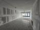 Under construction living room with tiled floors and water view at 1751 Beach Rd # 204, Englewood, FL 34223