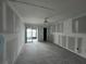 Large living room with new tile floors and drywall at 1751 Beach Rd # 204, Englewood, FL 34223