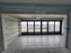 Living room with built in shelving and a water view at 1751 Beach Rd # 204, Englewood, FL 34223