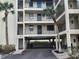Condo parking garage entrance with parking space at 1751 Beach Rd # 204, Englewood, FL 34223