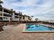 Community pool and deck area with waterfront views at 1751 Beach Rd # 204, Englewood, FL 34223