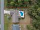 Aerial view of home with pool and yard at 2251 Meetze St, Port Charlotte, FL 33953