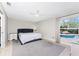 Main bedroom with king bed, ensuite bathroom and pool view at 2251 Meetze St, Port Charlotte, FL 33953