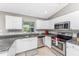 Bright kitchen with stainless steel appliances and granite countertops at 2251 Meetze St, Port Charlotte, FL 33953