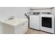 Laundry room with washer, dryer and utility sink at 2251 Meetze St, Port Charlotte, FL 33953