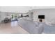 Open living and kitchen area with a gray couch and dining table at 2251 Meetze St, Port Charlotte, FL 33953