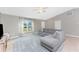 Spacious living room with L-shaped sofa and large window at 2251 Meetze St, Port Charlotte, FL 33953