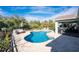 Relaxing kidney-shaped pool with patio and seating area at 2251 Meetze St, Port Charlotte, FL 33953