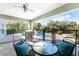 Covered patio overlooking the pool and lush landscape at 2251 Meetze St, Port Charlotte, FL 33953