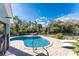 Inviting kidney-shaped pool with patio furniture at 2251 Meetze St, Port Charlotte, FL 33953