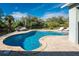 Stunning kidney-shaped pool with patio furniture at 2251 Meetze St, Port Charlotte, FL 33953