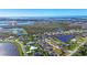 Aerial view of a waterfront community with numerous houses and lakes at 2271 Paraiso Ct, Englewood, FL 34224