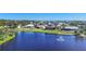 Aerial view of community with lake and homes at 2271 Paraiso Ct, Englewood, FL 34224