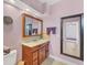 Bathroom with vanity, mirror, and shower at 2271 Paraiso Ct, Englewood, FL 34224