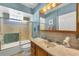 Bathroom with tub, shower, and vanity at 2271 Paraiso Ct, Englewood, FL 34224